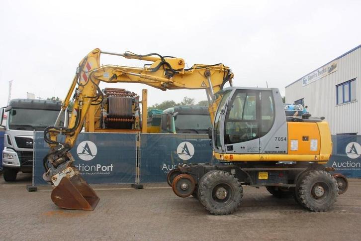Veiling: Wielgraafmachine New Holland MH5 Plus Diesel 2008, Zakelijke goederen, Machines en Bouw | Kranen en Graafmachines, Ophalen