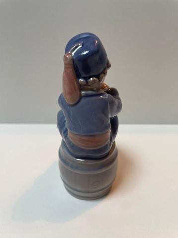 Royal Copenhagen - Figure - A boy sitting on a barrel