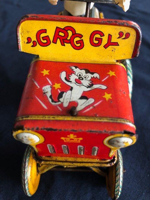 E.T.GR - Groggy - Gekke wind-up auto met celluloidfiguur,, Antiek en Kunst, Antiek | Speelgoed