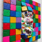 Gregos (1972) - White mockery behind colored bricks