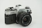 Canon AE-1 + Canon 28mm Lens