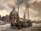 Anton Rutgers (1880-1954) - Gezicht op Amsterdam met boten