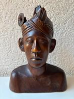 Traditional hand-carved Balinese busts husband and wife -