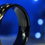 Tungstenen ring. Goud- en meteoriet-inlegwerk. De energie, Nieuw