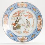 Schotel - A Chinese plate with iron red grisaille gilt decor