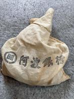 Japan. Japanese vintage 5 Sen coins in Banks Hotei (Zonder