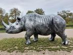 beautiful sculpture of a rhinoceros in silver bronze finish