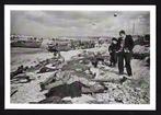 Robert Capa (1913–1954) - French fishermen looking at fallen