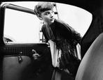 Bob Willoughby - Audrey Hepburn 1954 getting into the car.