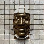 Gregos - Golden effect smile behind bricks